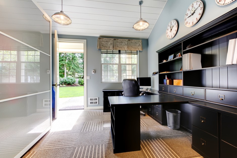 Blue modern home office interior design with dark brown furniture.